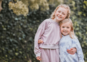 Wall Mural - Dont believe in angels You havent seen my sister. Shot of two adorable little girls having fun in a garden.