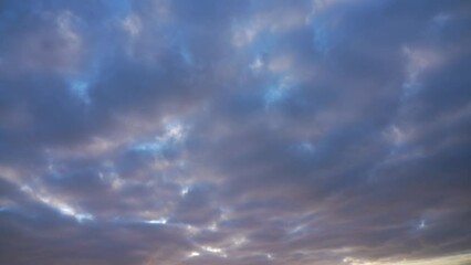 Wall Mural - beautiful early morning colorful sunny sunrise blue sky with fluffy purple and white clouds flying o
