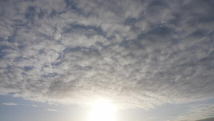 Wall Mural - beautiful early morning sunny sunrise blue sky with fluffy white clouds flying overhead in clear blu