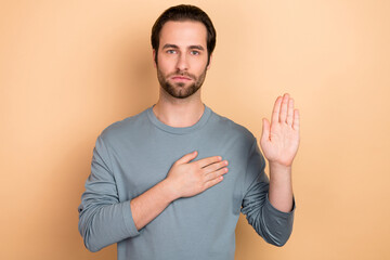 Sticker - Photo of young man arm on heart make promise to tell the truth court isolated over beige color background