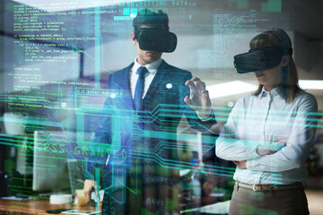 Doing business in the digital realm. Multiple exposure shot of two coworkers brainstorming together in the office while wearing VR headsets.