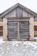 Old Wooden Shed Doors Exterior on White Brick Wall