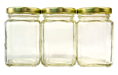 Wall Mural - Three empty glass jars with gold caps. Isolated.