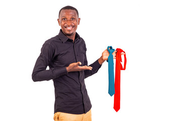 Wall Mural - young business man showing two ties smiling.