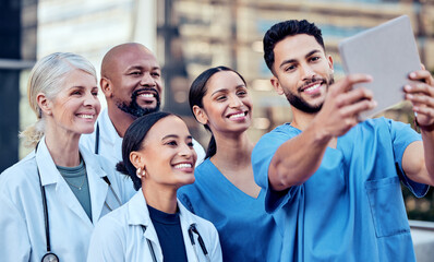 Poster - colleagues who became friends. shot of a group of doctors taking a selfie in the city.