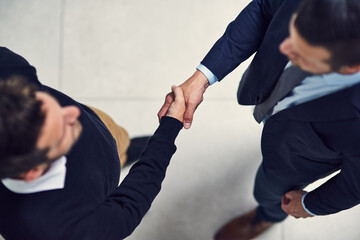 Aufkleber - Its been a pleasure doing business with you. High angle shot of two businessmen shaking hands in an office.