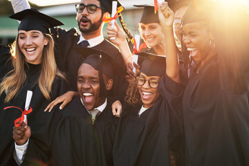 Poster - Our parents are so proud of us. Shot of a group of cheerful university students on graduation day.