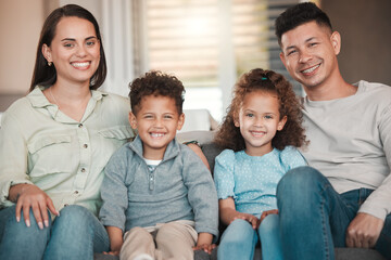 Wall Mural - So much happiness. Shot of a young family spending time together at home.