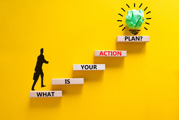 Wall Mural - Action plan symbol. Concept words What is your action plan on wooden blocks. Businessman icon. Beautiful yellow table yellow background. Business What is your action plan concept. Copy space.