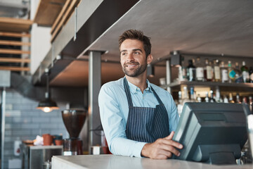 Poster - Ready to make a success of the day. Shot of a young entrepreneur working in a cafe.