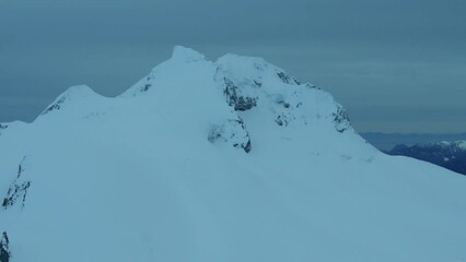 Wall Mural - 4k aerial of the coast mountains in late winter, garibaldi provincial park, british columbia, canada