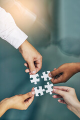 Poster - We fit together as a team. Shot of hands putting puzzle pieces together.