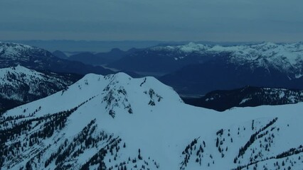 Wall Mural - 4k aerial of the coast mountains in late winter, garibaldi provincial park, british columbia, canada