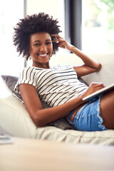 Poster - Weekend time is my time. Portrait of a happy young woman relaxing on the sofa with a laptop.