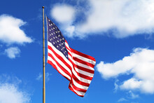 Huge Large Waving American Flag Flagpole Blue Sky America Holiday Raised Flying Windy Pride Symbol Red White Blue Clear Wind Tall Stars Stripes