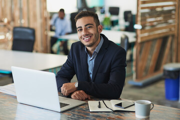 Poster - Its going to be another productive day. Portrait of a young businessman working on a laptop in an office.