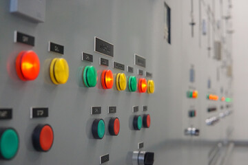 Wall Mural - Electrical selector switch,button switch,Electrical switch gear at Low Voltage motor control center cabinet in coal power plant. blurred for background.