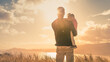 Leinwandbild Motiv Fatherhood, and single dad concept. Father holding his child looking to the sunset