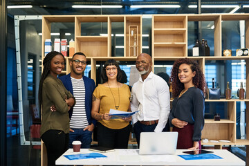 Aufkleber - Getting organized for great success. Portrait of a group of designers posing together in their office.