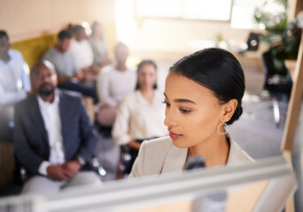 Poster - Delivering her presentation expertly. Cropped shot of an attractive young businesswoman giving a presentation in the boardroom.