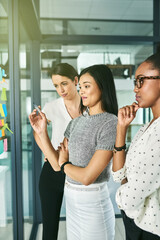 Poster - Start with a plan. Cropped shot of three businesswoman strategising in their office.