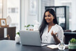 © Nicholas Felix/peopleimages.com - Getting work done via webcam. Shot of a young businesswoman making a video call on a laptop in an office.