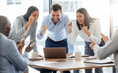 Poster - We can do this. Shot of a group of businesspeople cheering while using a laptop in an office at work.