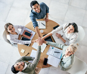 Poster - Work ethic will be reflected in everything you do. High angle shot of a group of young businesspeople joining hands in solidarity in a modern office.