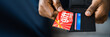Leinwandbild Motiv African Hand Holding Gift Card Voucher