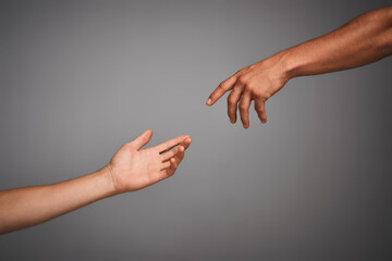 Poster - Get in touch with your classical side. Studio shot of unidentifiable hands reaching for each other against a gray background.