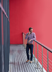 Aufkleber - Taking a private phone call on the balcony. Shot of a young businessman talking on a phone on the balcony of an office.