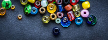 Top View Of Colorful Glass Beads On A Black Background