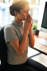 Canvas Print - Its that time of the year. Shot of a young businesswoman blowing her nose in an office.