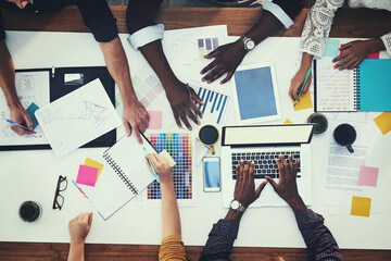 Poster - All hands in for a new creative project. High angle shot of a group of businesspeople having a meeting in a modern office.