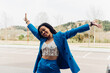 © Dani D.G - Delighted black woman in trendy outfit