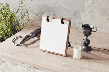 Simple desk calendar on a wooden base mockup. 3D rendering