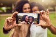 © T Chithambo/peopleimages.com - The ultimate selfie queens. Cropped shot of two female best friends taking a picture in a public park.