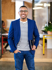 Poster - Applying the lens of efficiency to all aspects of business. Shot of a handsome young designer standing in his office.