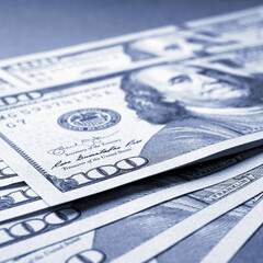 Wall Mural - american paper money. several one hundred dollar notes lie on textured surface. focus on the number 