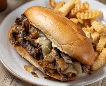Philly Cheesesteak Sandwich And French Fries