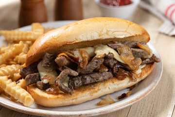 Wall Mural - Philly cheesesteak sandwich and french fries