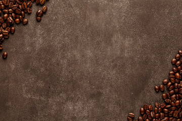 Wall Mural - Obsolete stone background with roasted coffee beans on opposite corners