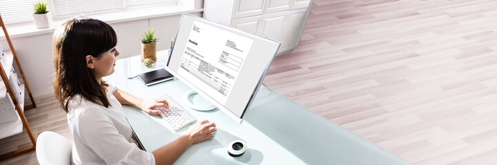 Poster - Businesswoman Calculating Invoice On Computer