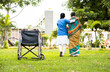 focus on armchair, Nurse taking walk by supporting senior old woman from wheelchair - concept rehabilitation, caretaker and medicare treatment