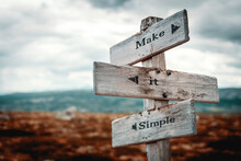 Make It Simple Text Quote Written In Wooden Signpost Outdoors In Nature. Moody Theme Feeling.