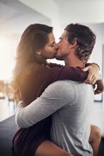 This Is All I Need To Have A Good Day. Shot Of A Young Couple Making Out In The Kitchen.