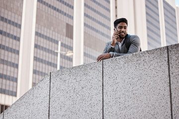 Poster - Hes connected wherever he goes. Shot of a young businessman on a call in the city.