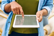 © T Chithambo/peopleimages.com - Out looking for hotspots. Cropped shot of a woman using a digital tablet while out in the city.