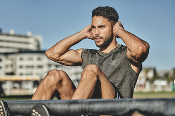 Canvas Print - All youve got to do is not quit. Shot of a muscular young man exercising at a calisthenics park.