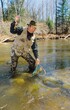 An angler netting a trout 